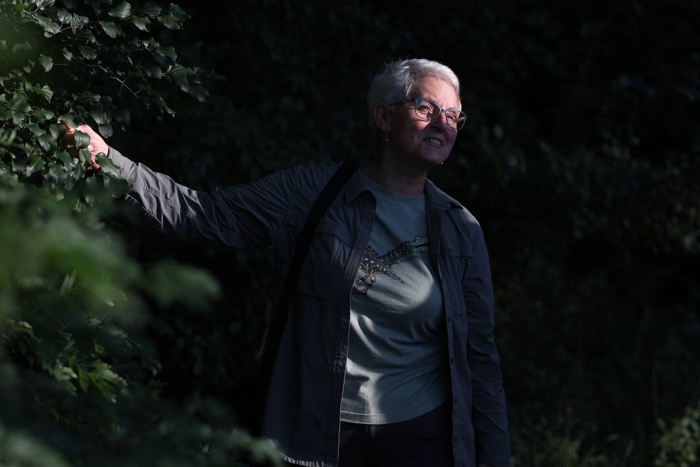 Arborist Rita Renwick points out an invasive tree during an educational Tree Walk at the Arboretum at the Broadway Greenway in Joliet on Wednesday, Aug. 16, 2023.