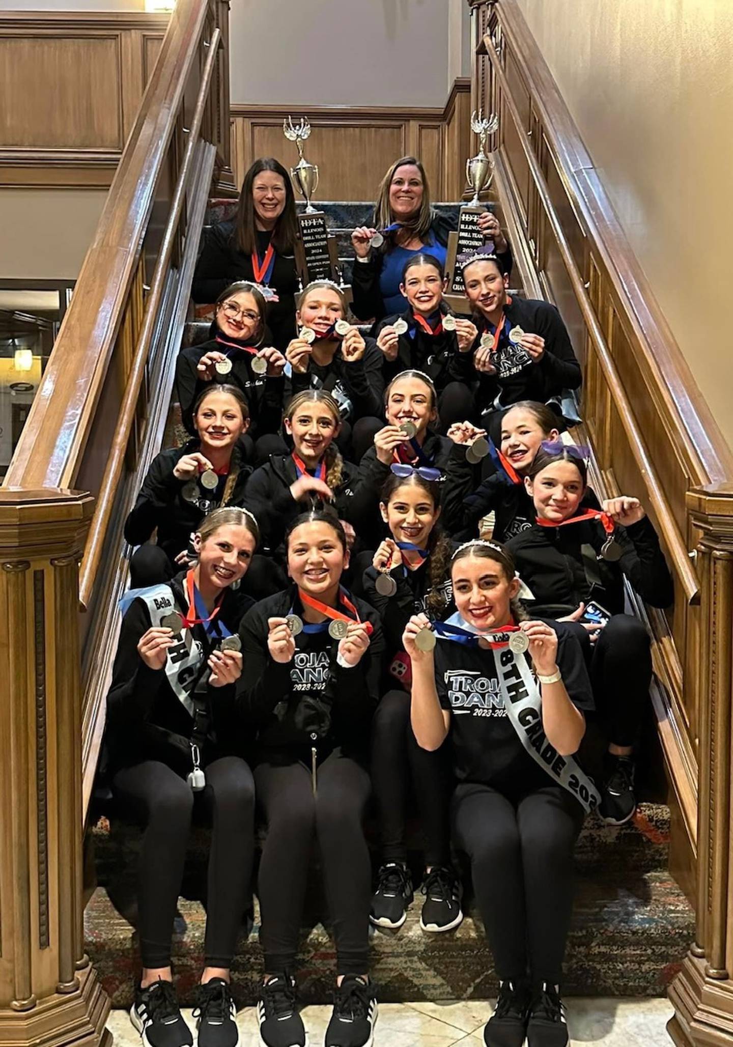 Members of the Troy Middle School dance team show off their medals after their state championship performance on Feb. 10.