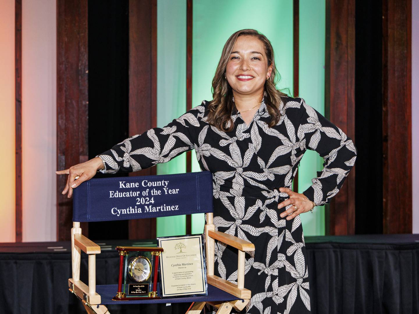 Cynthia Martinez of Fred Rodgers Magnet Academy and a middle school teacher in East Aurora District 131 stands with the 2024 Educator of the Year award she won at ROE's Educator of the Year Banquet on Friday.