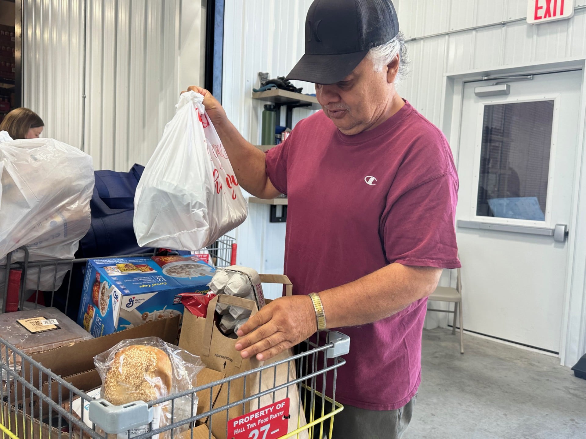 Jose Ontiverus volunteers Wednesday, June 12, 2024, at the Hall Township Food Pantry in Spring Valley.