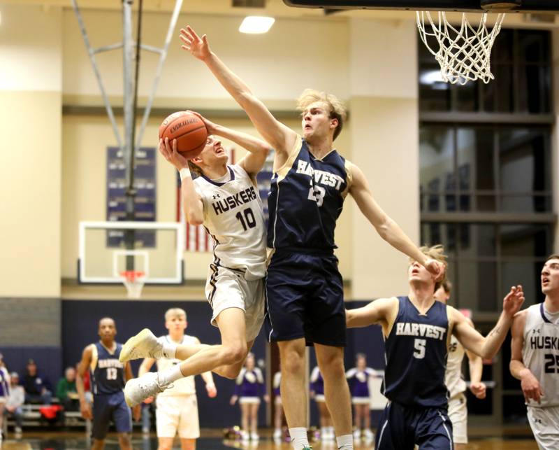 Serena’s Carson Baker has his shot blocked by Harvest Christian Academy’s Kaden Meeker during the Class 1A Harvest Christian Academy Sectional semifinal game on Wednesday, Feb. 28, 2024 in Elgin.