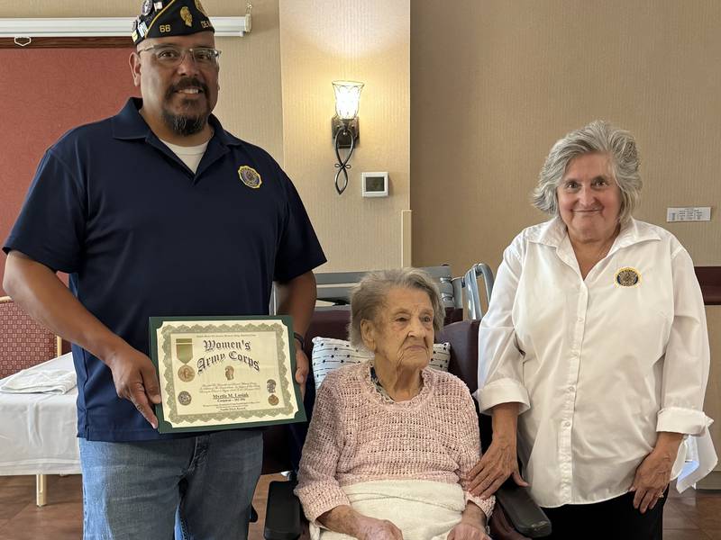 (From left): DeKalb American Legion Post No. 66 commander Manuel Olalde, World War II veteran and DeKalb resident Myrtle Lusiak, and DeKalb American Legion Post 66 member Charlotte Hodder, pose after Lusiak was presented with a Women's Army Corps medal on July 1, 2024 at her home in Aperion Care assisted living facility in DeKalb.