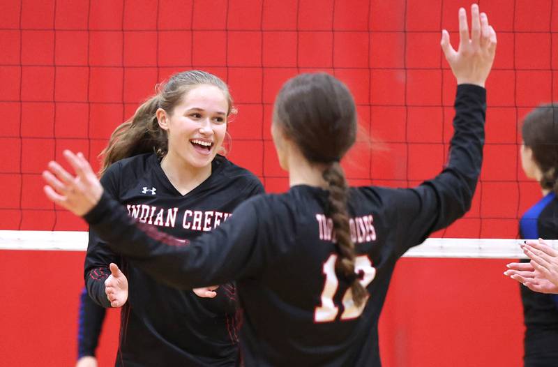 Indian Creek players celebrate a point during their regional first round match against Somonauk Tuesday, Oct. 25, 2022, at Aurora Christian High School in Aurora.