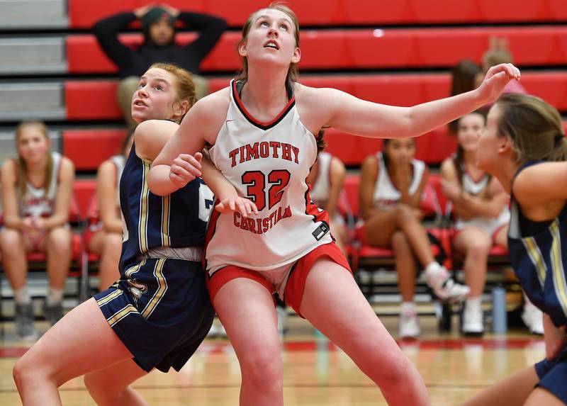 Timothy Christian's Grace Roland (32) jockeys for rebound position with IC Catholic's IC Catholic's Maura Grogan during the Class 2A Timothy Christian Regional championship game on Feb. 17, 2023 at Timothy Christian High School in Elmhurst.