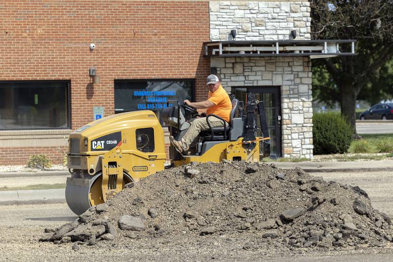 Eric Edler of Porter Brothers works on the parking lot of the former Applebees restaurant Tuesday, Sept. 10, 2024, in Sterling. Paving will begin next week. The restaurant closed in 2020 after 20 years in business.