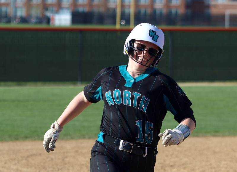 Woodstock North’s Mackenzie Schnulle rounds the bases on a home run in varsity softball at Crystal Lake Central Friday.