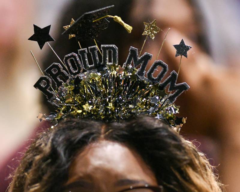 A mom of a graduating senior shows her support during the DeKalb High School 2024 graduation ceremony held Saturday, May 25, 2024, Northern Illinois University Convocation Center in DeKalb.