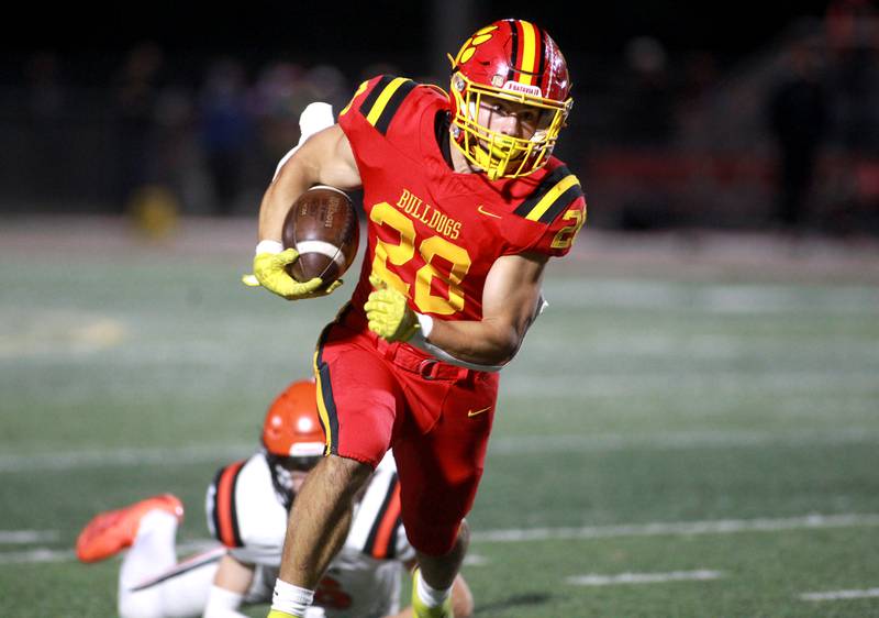 Batavia’s Nathan Whitwell runs the ball on Friday, Oct. 18, 2024 during a game against Wheaton Warrenville South in Batavia.