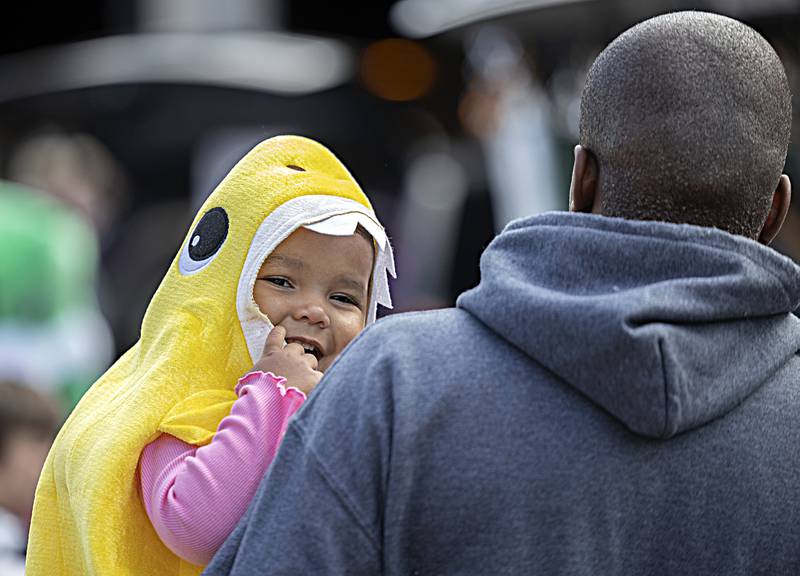 Evalyn Harts, 1, is all smiles as she is carried by dad Joseph in Dixon Saturday, Oct. 28, 2023 during the Treat Street trick or treating event.