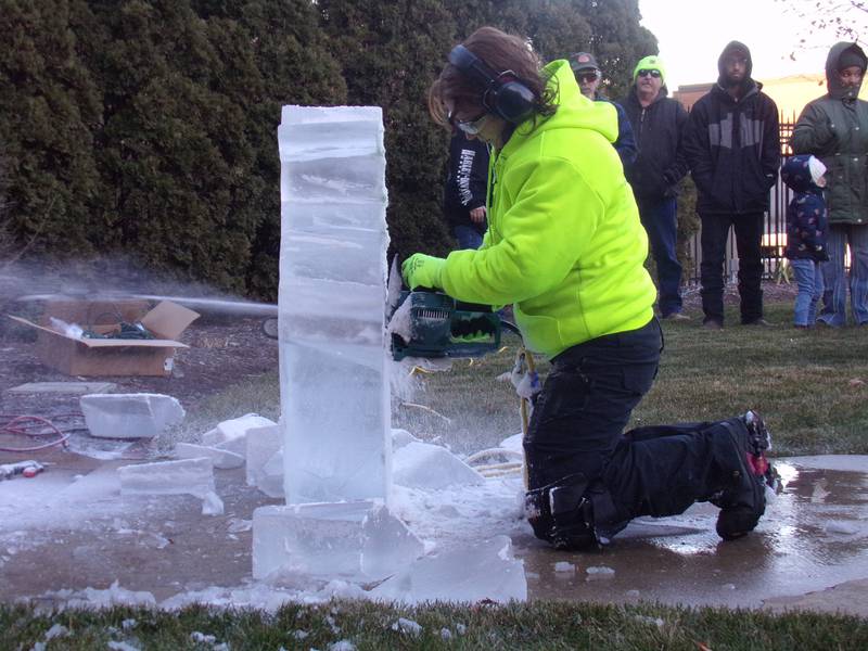 Ice shavings fly Saturday, Nov. 25, 2023, during the ice sculpture demonstrations at Heritage Park as part of the Keeping Christmas Close to Home celebration in Streator.