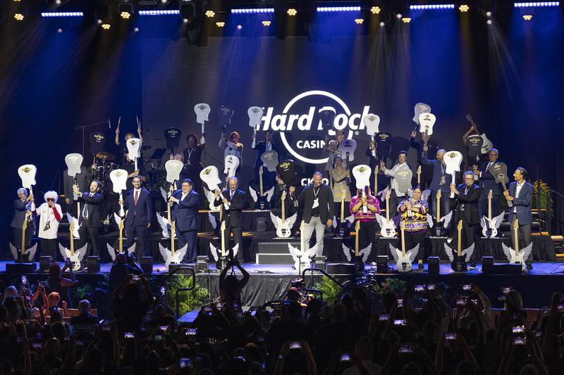 Dignitaries and VIPs raise their guitars for a ceremonial smash Thursday, Aug. 29, 2024, to open the Hard Rock Casino Rockford.