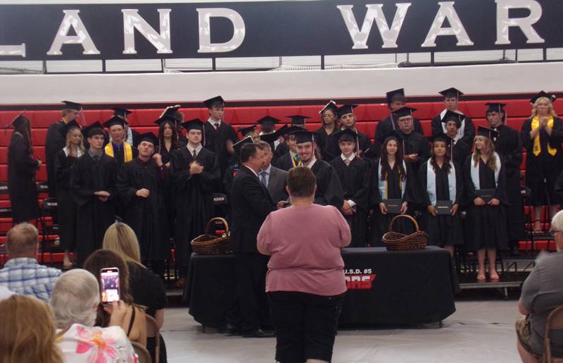 Woodland High School graduates pose for photos after receiving their diplomas Sunday, May 19, 2024, at the school's graduation ceremony in the gymnasium.