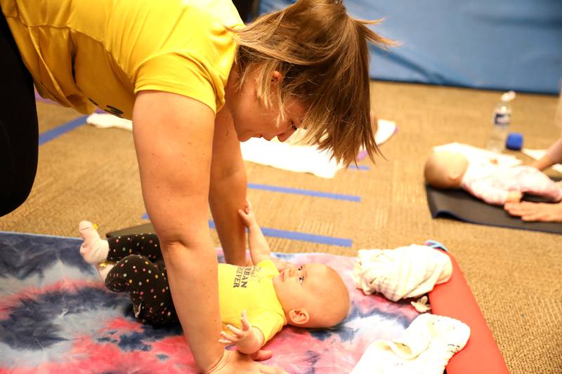 Kristen Calvallo of Hanover Park and her daughter, Kalylah, 5 months, participate in a baby yoga class at Northwestern Medicine Central DuPage Hospital in Winfield.