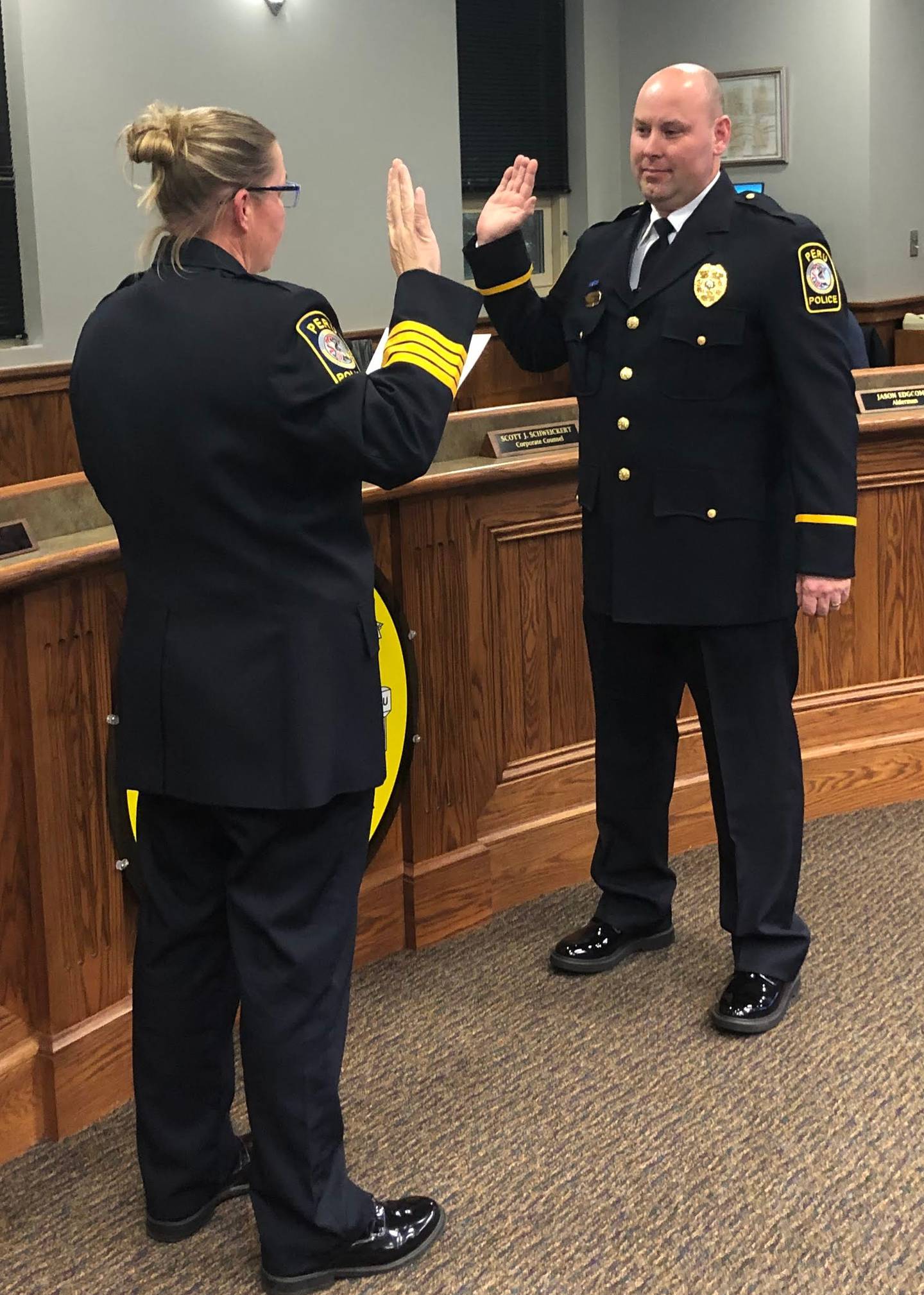 Peru Police Chief Sarah Raymond swears in John Atkins as patrol sergeant Monday, Feb 27, 2023 at City Hall.