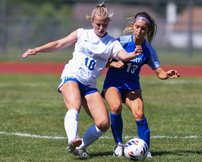 Wheaton North's Grace Kuczaj (13) and St. Charles North's Chloe Kirsten (10)  battle for the ball during the sectional title game held at South Elgin High School on Saturday May 25, 2024.