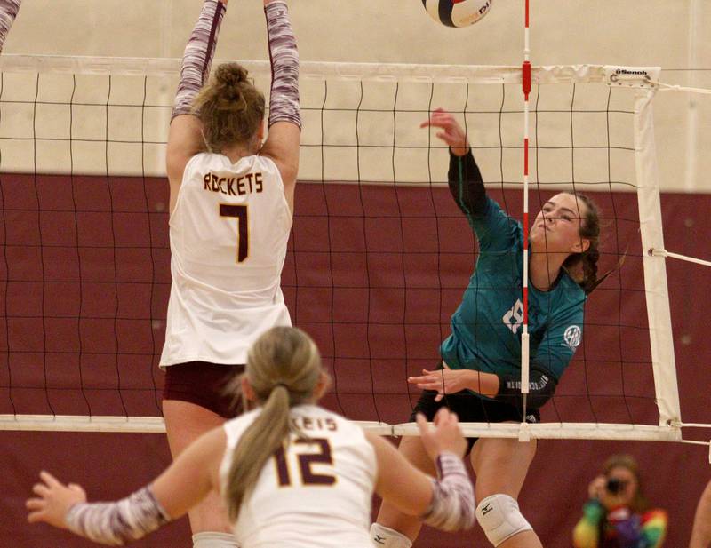 Woodstock North’s Jayden Johnson sends the ball over the net  in varsity volleyball on Monday, Sept. 16, 2024, at Richmond-Burton High School in Richmond.