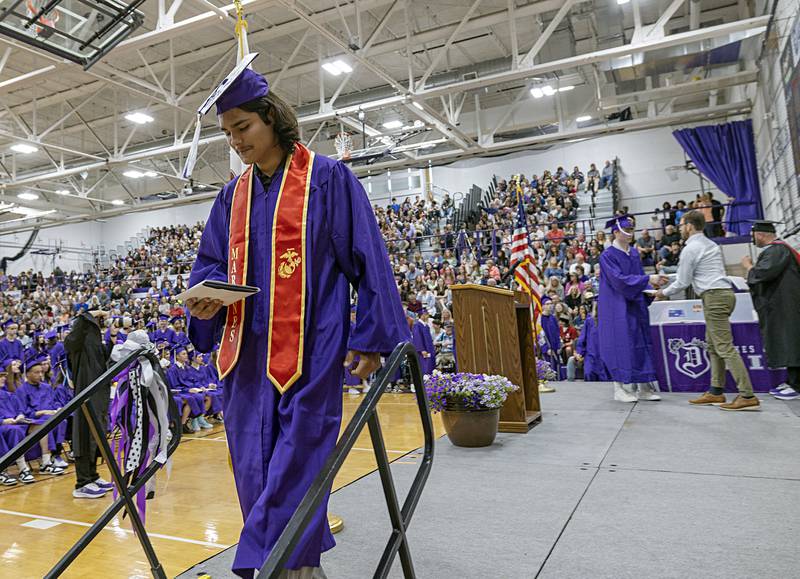 Diego Ocampo leaves the stage after accepting his diploma Sunday, May 26, 2024 at Dixon High School. Ocampo is one of four class of 2024 members joining the military after graduation.