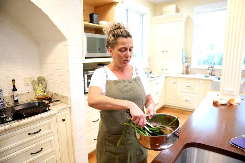 Carolyn O'Reilly makes mushroom and asparagus tacos in the kitchen of her Geneva home. O’Reilly is a favorite to win a chef contest to be on the Taste Of Home magazine cover and win $25,000.