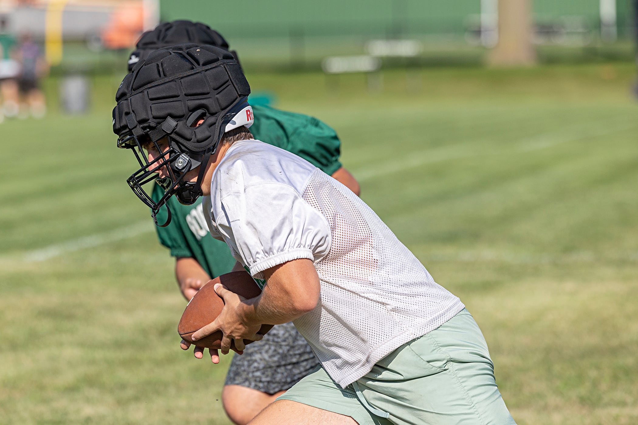 Rock Falls’ Mason Landis turns up field to run Tuesday, Aug. 13, 2024 during practice. Illinois football teams started practice this week for the 2024 season.