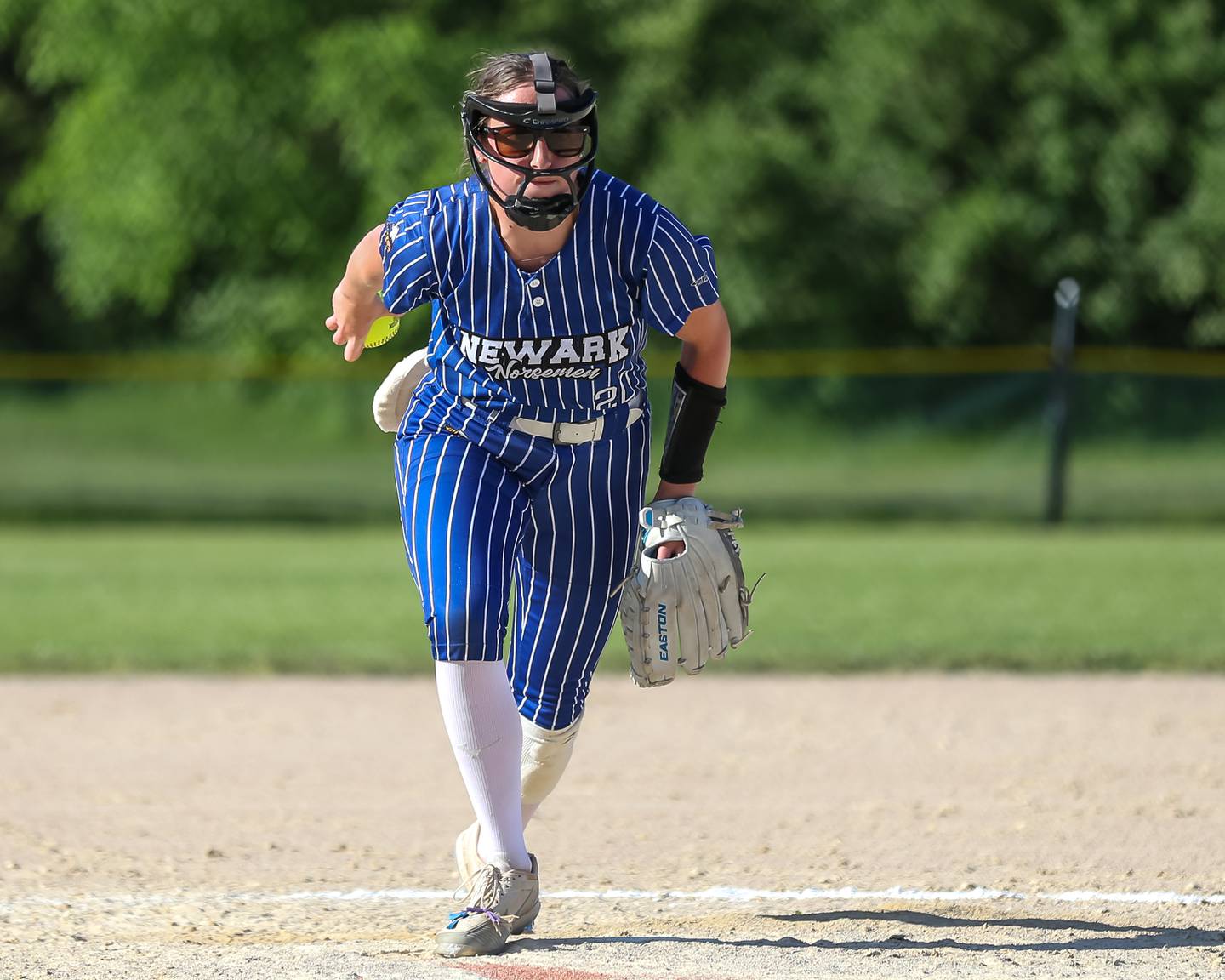 Newark's Kodi Rizzo (20) winds up to deliver a pitch during the Class 1A Newark Regional final game between St. Edwards at Newark on May 17, 2024.