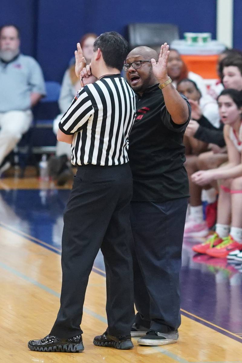 Bolingbrook's head coach Chris Smith pleads his case with an official during a Oswego semifinal sectional 4A basketball game against Benet at Oswego High School on Tuesday, Feb 20, 2024.