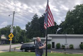 Upside-down flag stolen from Woodstock yard after prompting responses from strangers