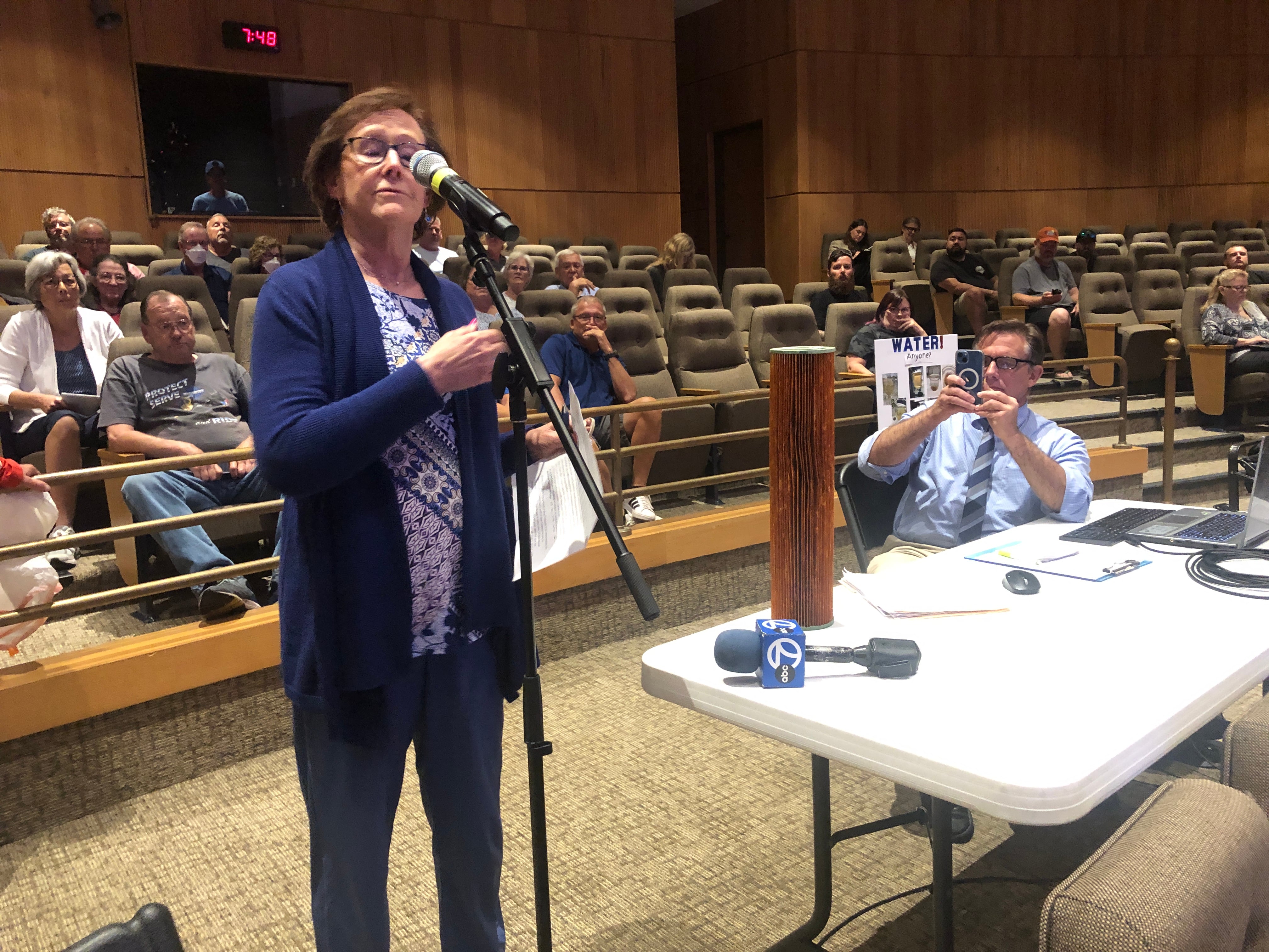 An Aqua Illinois customer brought a used water filter to the hearing held Monday, July 29, 2024, at McHenry County College. The private water utility company is asking the Illinois Commerce Commission to approve a rate hike customers say will add $30 a month to their water bills.