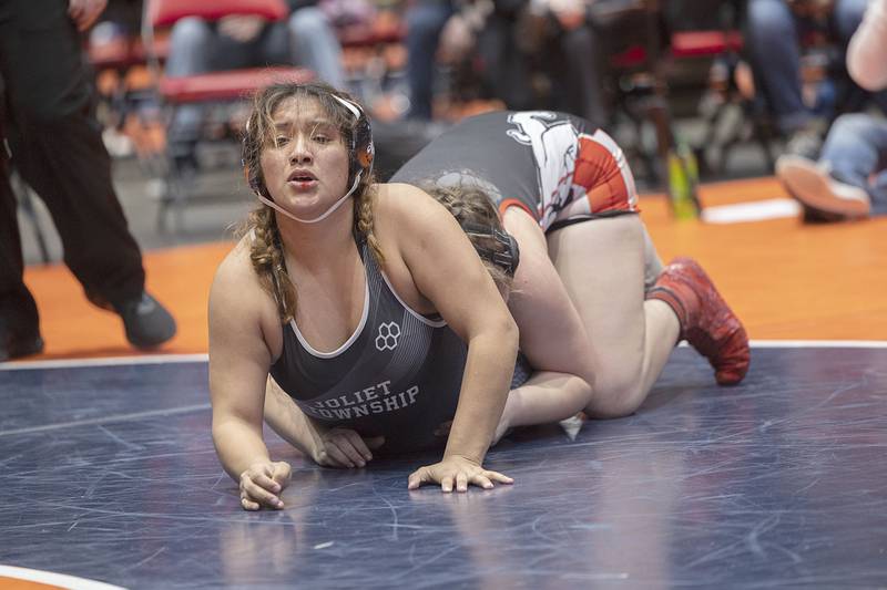 Joliet Central’s Nydia Martinez looks to get away from August Rottman of Highland in the 170 pound championship match at the IHSA girls state wrestling championships Saturday, Feb. 25, 2023. Rottman took the win.