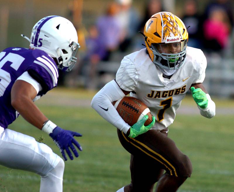 Hampshire’s Uriah Beamon, left, keeps up with Jacobs’ T.O. Boddie  in varsity football on Friday, Sept. 6, 2024, at Hampshire School in Hampshire.