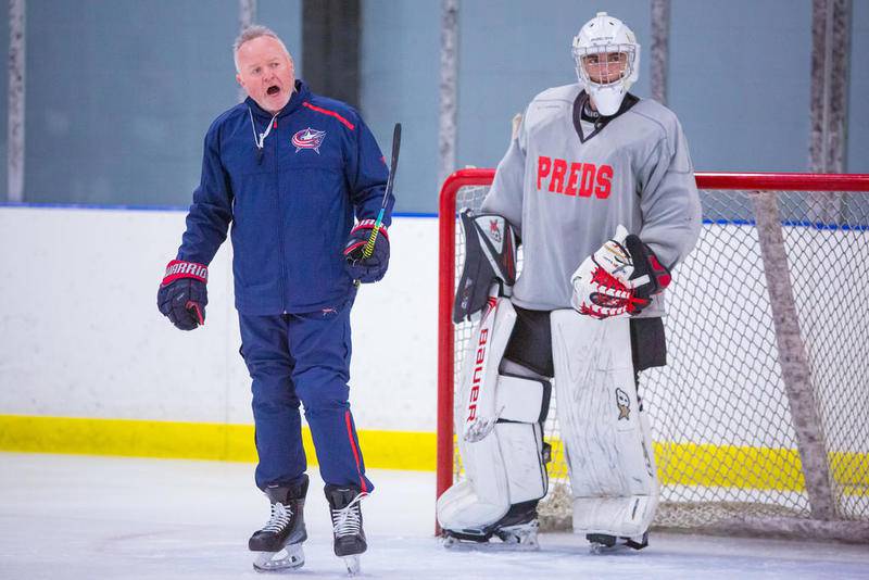 NHL Columbus Blue Jackets assistant coach and Crystal Lake resident Kenny McCudden explains a drill during a D155 Predators practice Thursday at Crystal Ice House in Crystal Lak