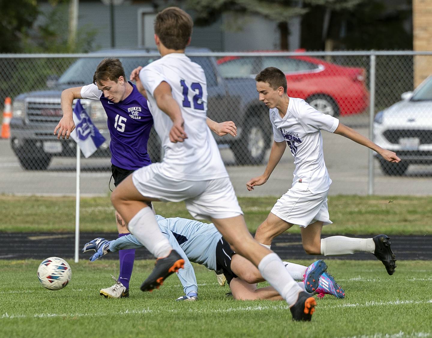 Dixon’s Logan Grett gets by Rockford Lutheran goalie Tre Wasemiller to score the first goal for the Dukes Wednesday, Sept. 18, 2024.