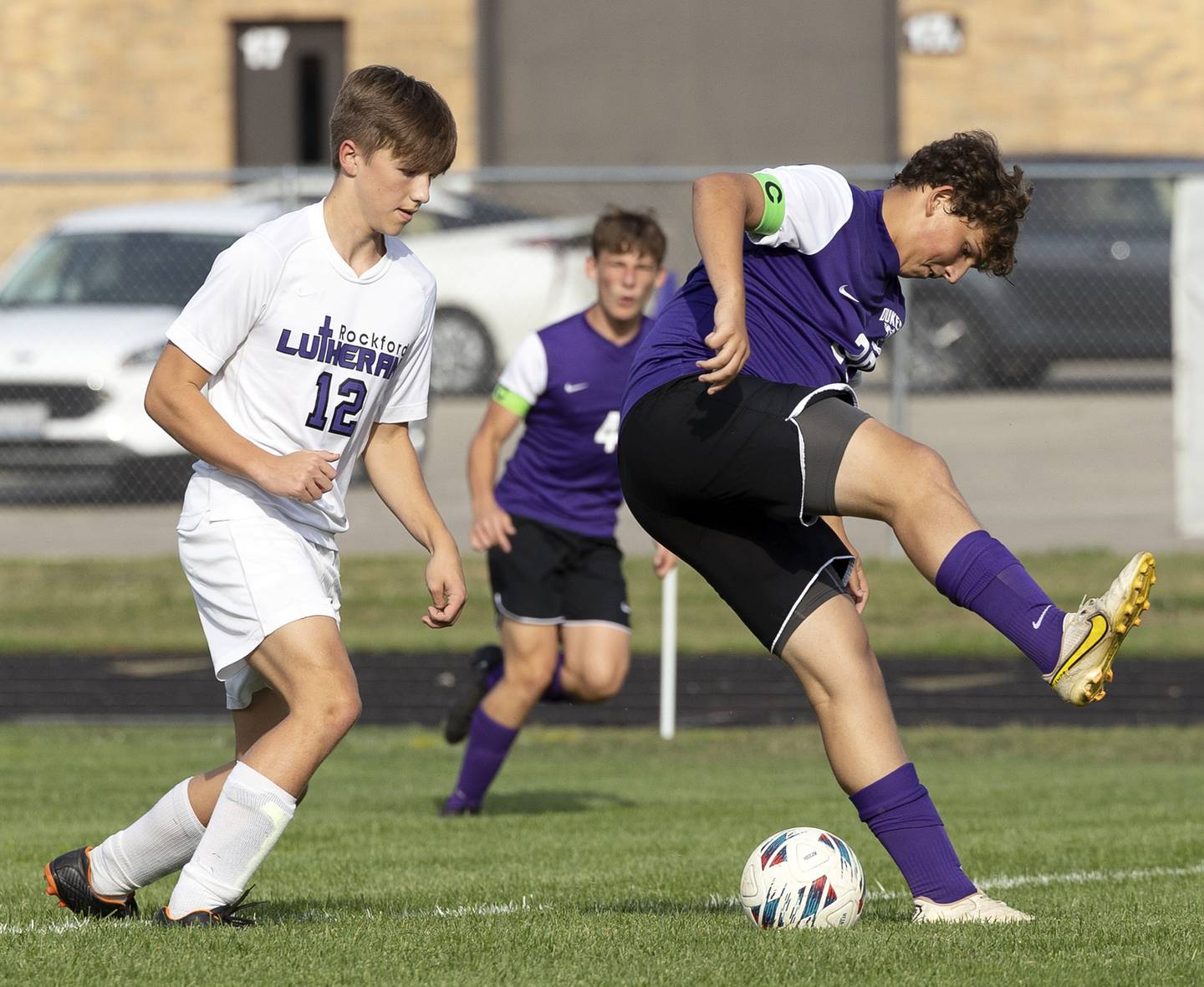 Dixon’s Jayvian Herwig keeps the ball in the offensive zone against Rockford Lutheran’s Bud Anderson Wednesday, Sept. 18, 2024.