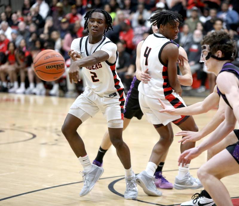 Bolingbrook’s D.J. Strong passes the ball during the Class 4A East Aurora Boys Basketball Sectional final against Downers Grove North on Friday, March 1, 2024.