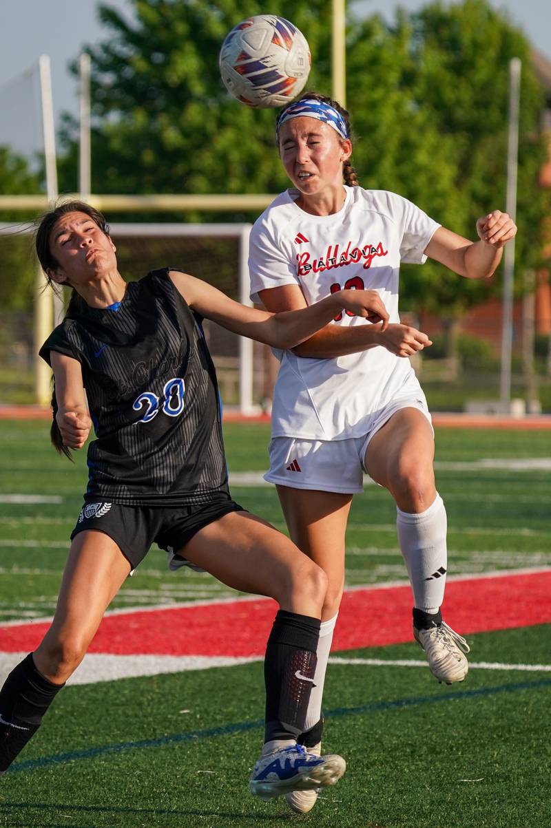 Batavia’s Abi Edwards (13) goes up for a header against St. Charles North's Aubri Magana (20) during a Class 3A Batavia Regional final soccer match at Batavia High School in Batavia on Friday, May 17, 2024.