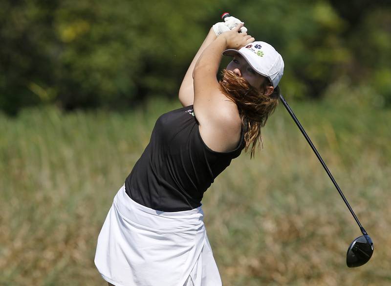 Crystal Lake Co-op’s Delaney Medlyn watches her tee shot on the 6th hole of the Valley course during the McHenry County Tournament on Thursday, Sept.12, 2024, at Boone Creek Golf Club in Bull Valley.