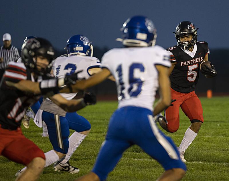 Erie-Prophetstown’s Demetree Larsen looks for running room against Newman Friday, Sept. 22, 2023 in a game at Erie.