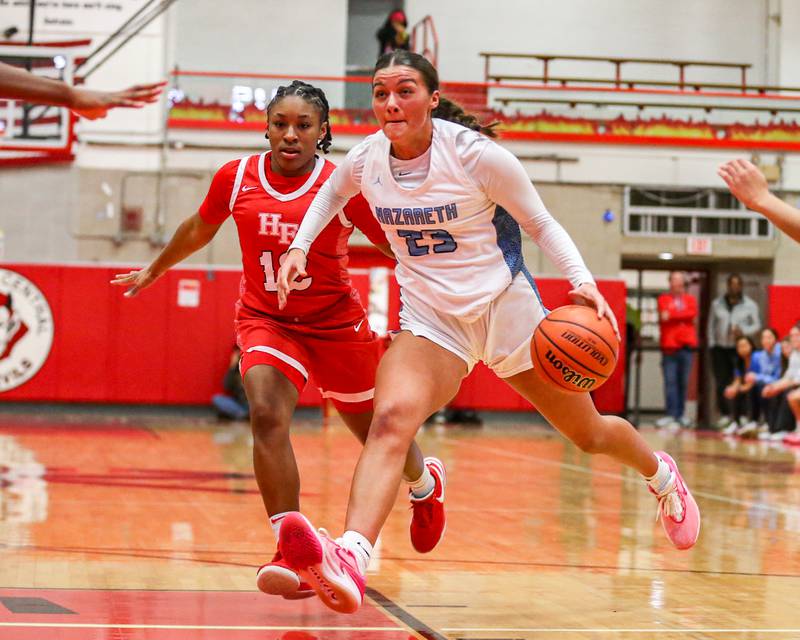 Nazareth's Danielle Scully (23) drives to the basket during Class 4A girls supersectional basketball game between Homewood-Flossmoor at Nazareth. Feb 26, 2024.