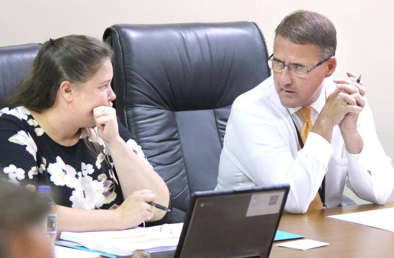 District 428 Board of Education President Samantha McDavid and Superintendent Jamie Craven talk Tuesday during their school board meeting at district offices. The board approved the contract for the DeKalb Classroom Teachers’ Association.