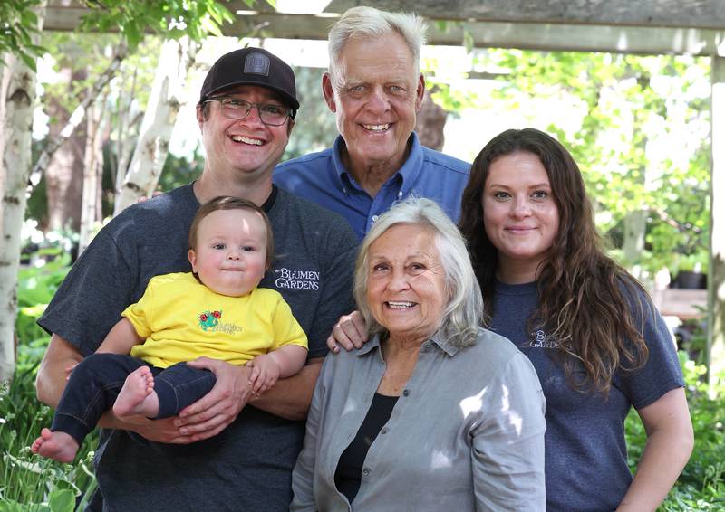 Joel Barczak (clockwise from top) co-owner of Blumen Gardens, with his daughter Jill Mandeville, co-owner, wife Joan Barczak, co-owner, grandson Clay Mandeville and son-in-law Keith Mandeville, manager, Wednesday, June 19, 2024, in the shade garden area at the store in Sycamore.