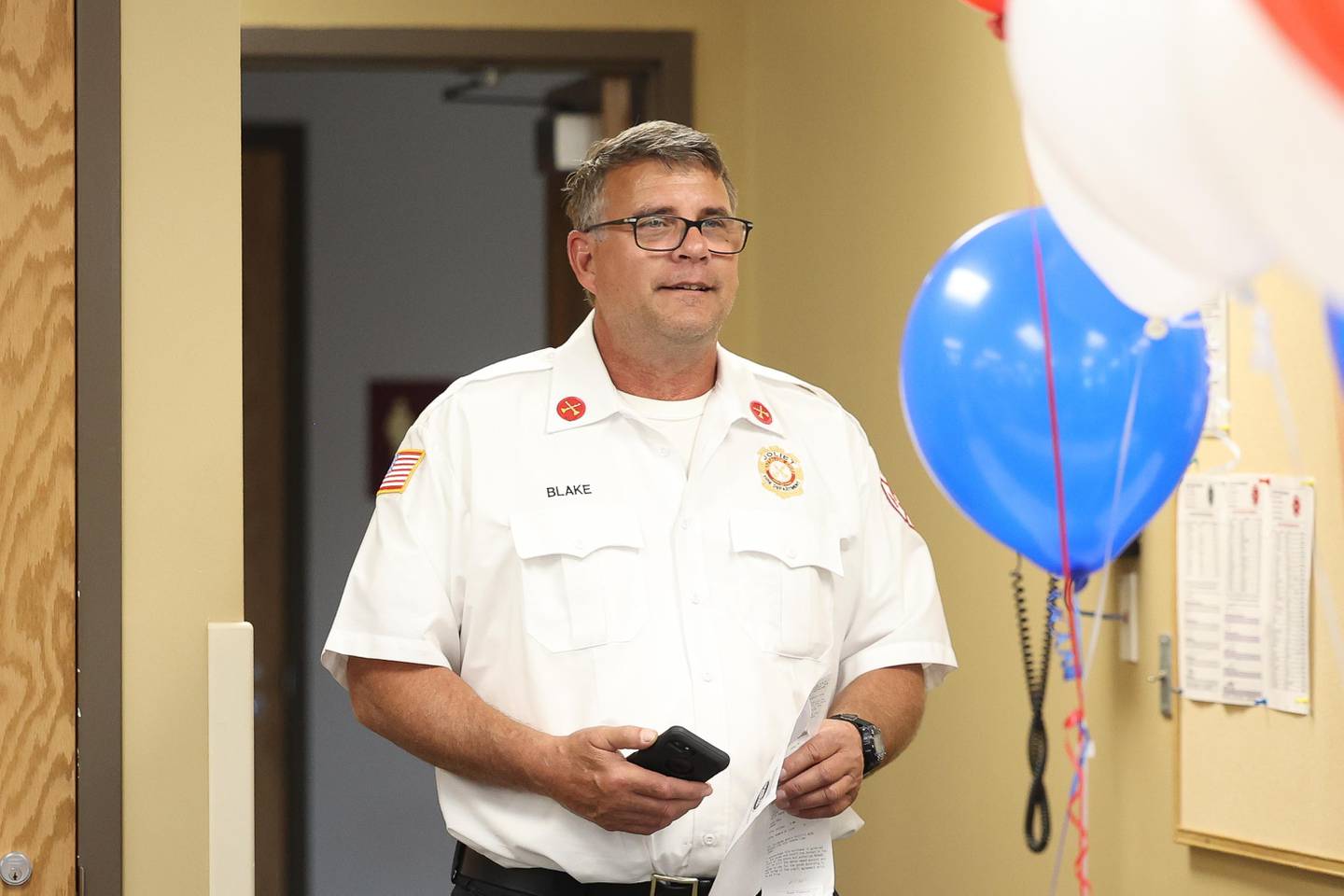 Battalion Chief Jim Blake was surprised at the annual pizza party host by Acey Longley and his mother, Heidi, on Wednesday, Sept. 11, 2024 in Joliet.