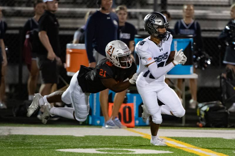 Plainfield East's Daniel Thomas takes down Oswego East;s Donavin Eason during a game on Thursday Sept. 12, 2024 at Plainfield East High School