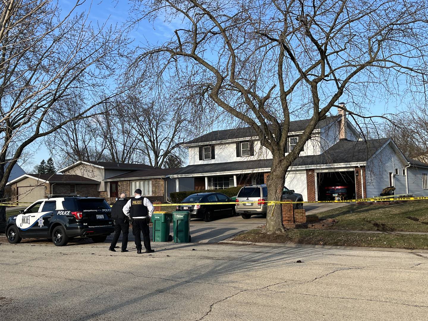 Officers at the blocked off entrance of 716 Fairlane Drive in Joliet. Officers responded to the scene of a fatal shooting on Monday, March 27, 2023.