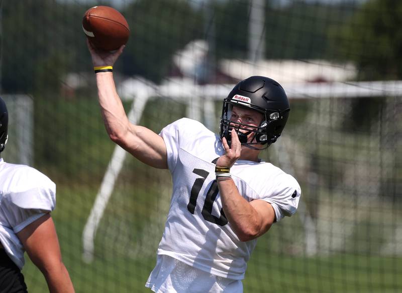 Sycamore quarterback Burke Gautcher throws a pass Monday, July 15, 2024, during summer football camp at Sycamore High School.