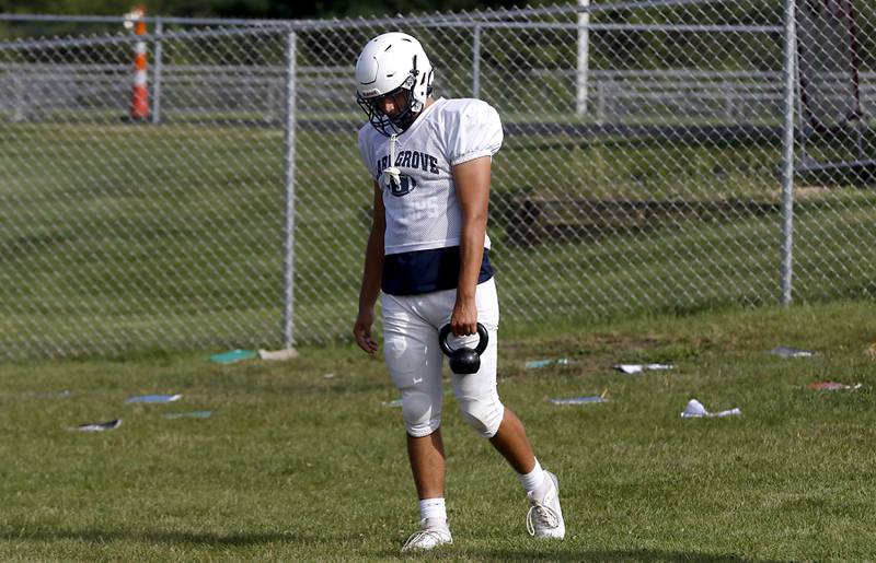 Luca Vivaldelli stretches during football practice Tuesday, Aug. 20, 2024, at Cary-Grove High School, as the 2023 IHSA Class 6A champions look to defend their title.