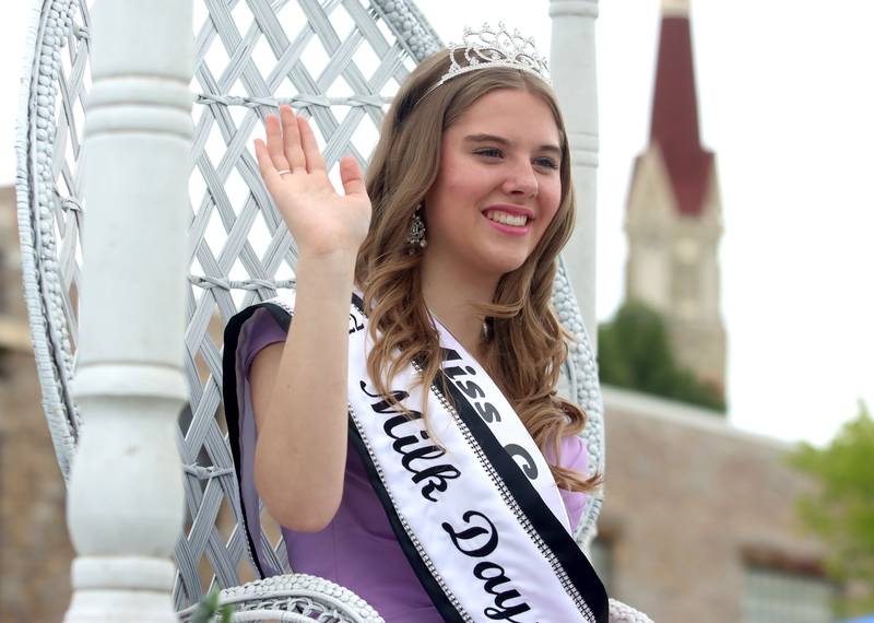 2022 Milk Days Queen Lily Jones waves from her float during the Harvard Milk Days parade Saturday, June 4, 2022, in Harvard.