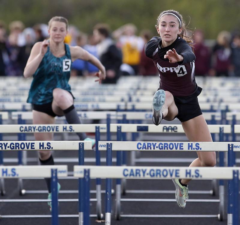 Prairie Ridge’s Rylee Lydon competes in the 100 meter hurdles Friday, April 21, 2023, during the McHenry County Track and Field Meet at Cary-Grove High School.