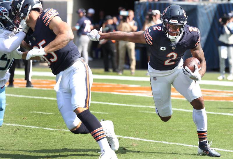 Chicago Bears wide receiver DJ Moore gets outside of the Tennessee Titans defense on a end around during their game Sunday, Sept. 8, 2024, at Soldier Field in Chicago.