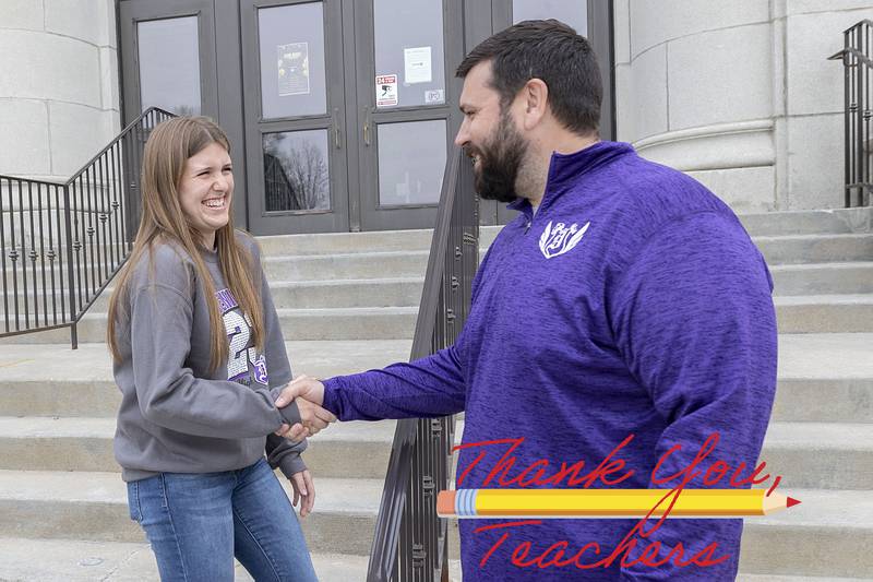 Dixon High School senior Hannah Lengquist and Pathways program instructor Brandon Woodward share a handshake outside of the school Thursday, April 20, 2023. The program helps students who are looking for careers in education.