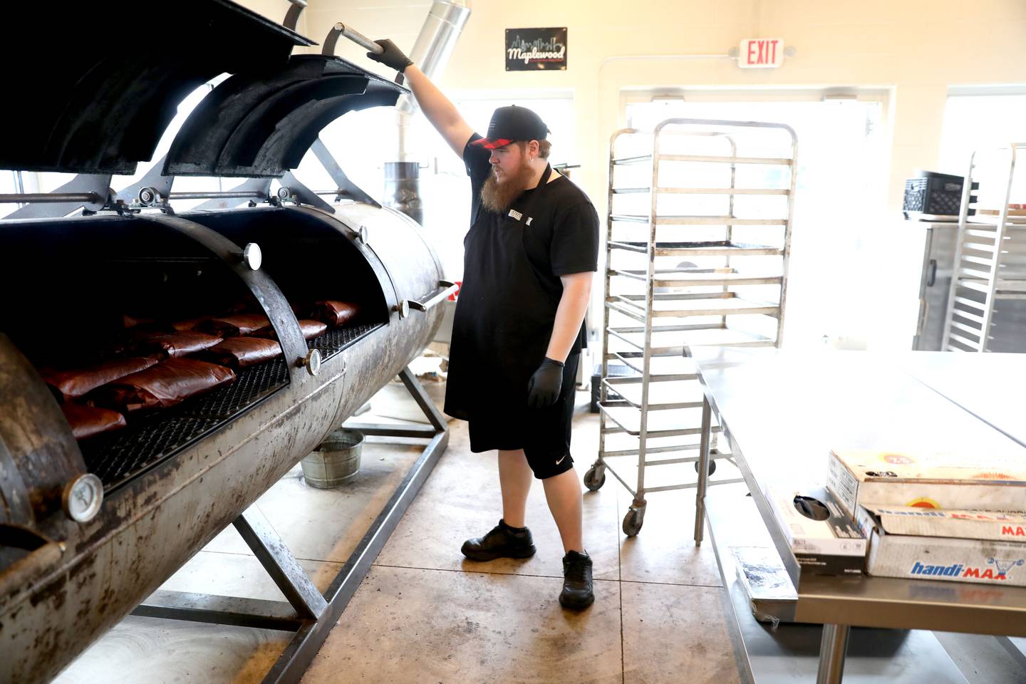 Jake Henry is the back-of-house manager at Station One Smokehouse, which recently opened at 524 E. Kendall Dr. in Yorkville.