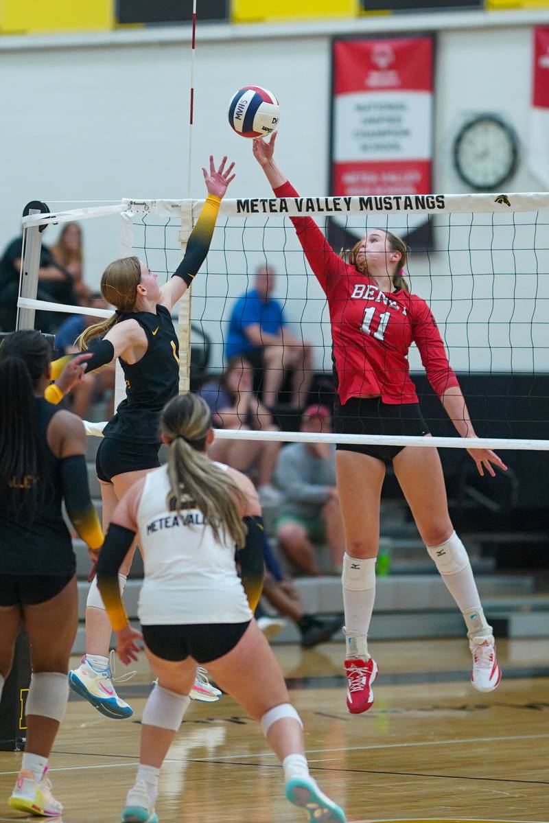 Benet’s Ellie Stiernagle (11) plays the ball at the net against Metea Valley's Ashley Ward (1) during a volleyball match at Metea Valley High School in Aurora on Wednesday, Sep 4, 2024.